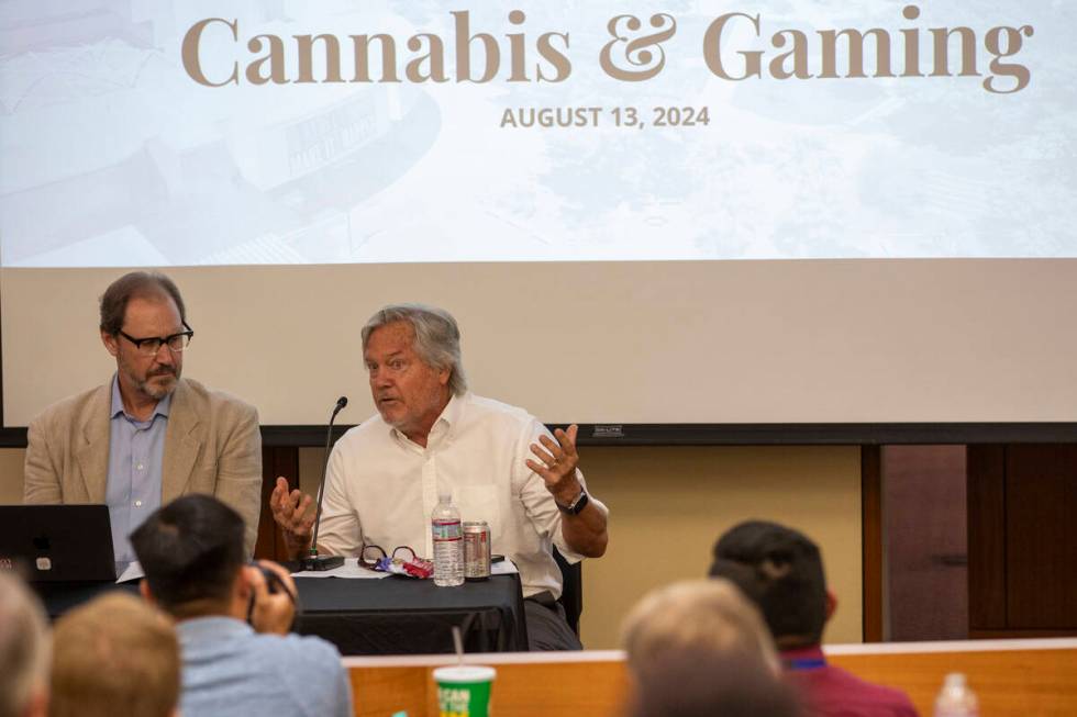 Cannabis attorney Bob Hoban, left, and Clark County Commissioner Tick Segerbloom, right, speak ...