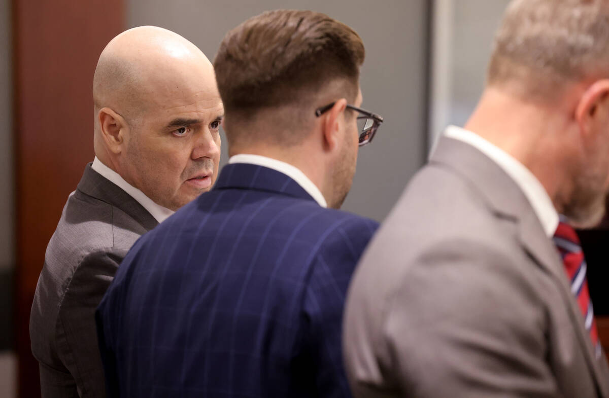 Robert Telles, left, listens in court with his attorneys Robert Draskovich, right, and Michael ...