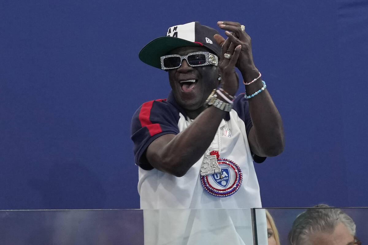 Flavor Flav cheers the U.S. team during a women's water polo Group B preliminary match between ...