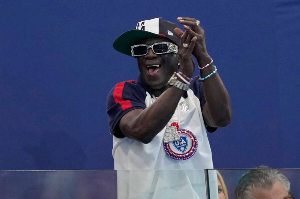 Flavor Flav cheers the U.S. team during a women's water polo Group B preliminary match between ...