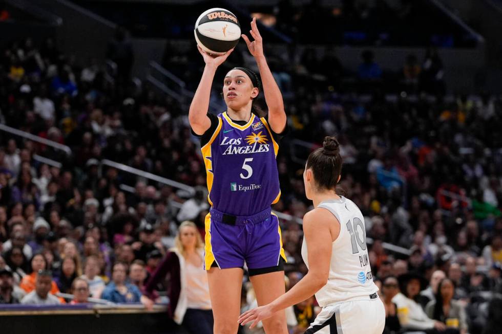 Los Angeles Sparks forward Dearica Hamby (5) shoots against Las Vegas Aces guard Kelsey Plum du ...