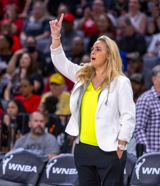 Aces head coach Becky Hammon signals to her players against the Phoenix Mercury during the ...