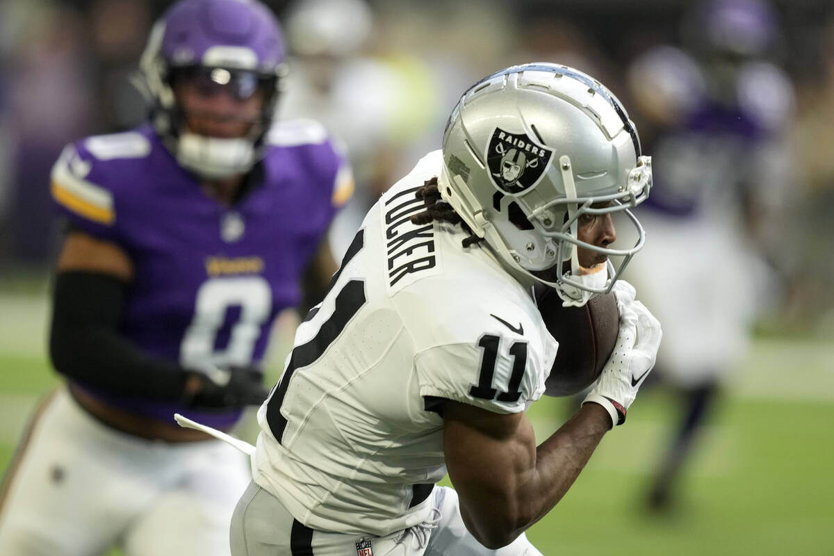 Las Vegas Raiders wide receiver Tre Tucker (11) catches a pass during the first half of an NFL ...