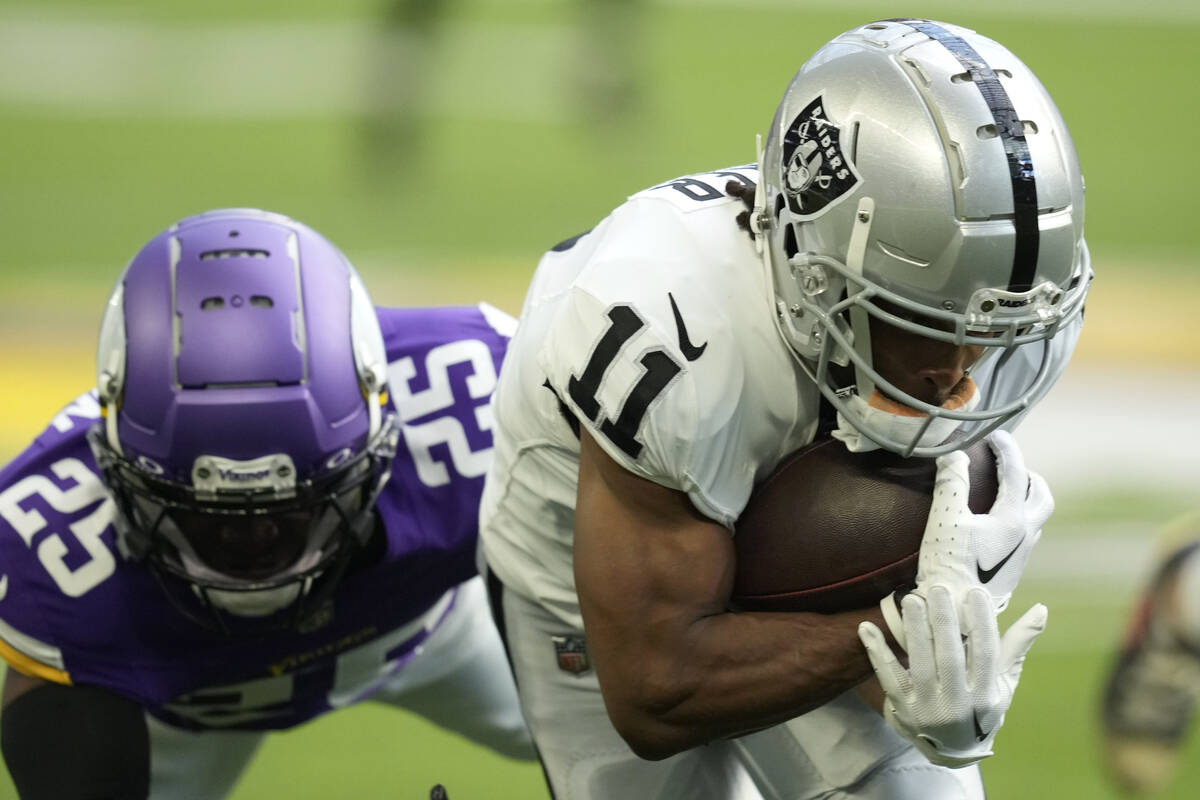 Las Vegas Raiders wide receiver Tre Tucker (11) catches a pass in front of Minnesota Vikings sa ...