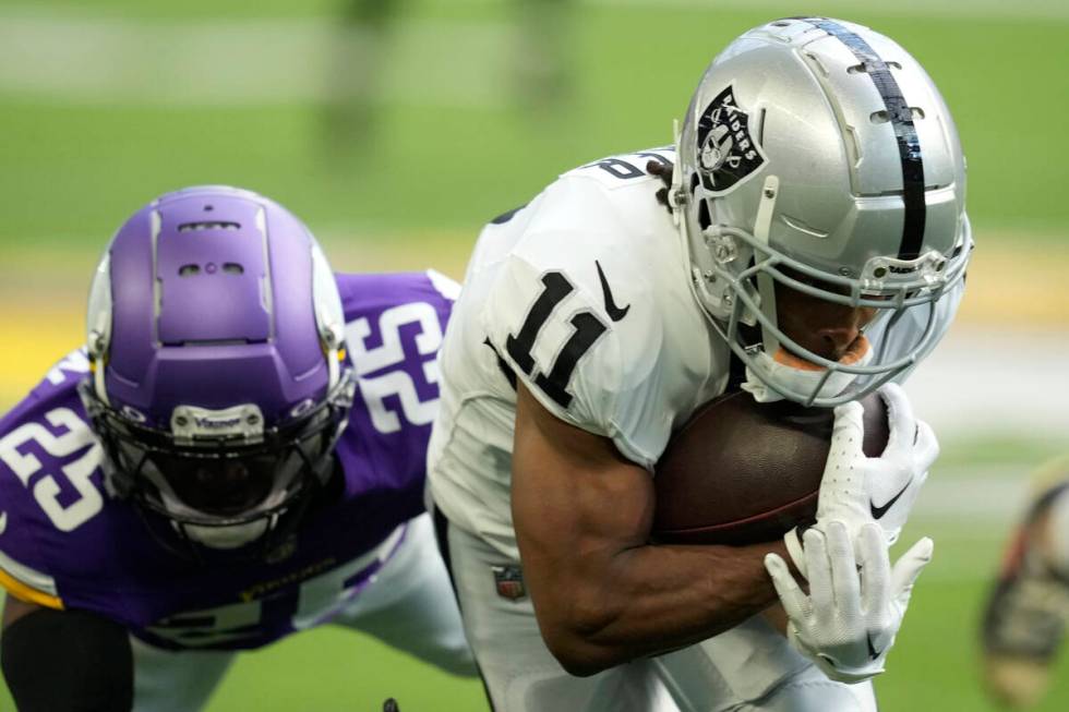 Las Vegas Raiders wide receiver Tre Tucker (11) catches a pass in front of Minnesota Vikings sa ...