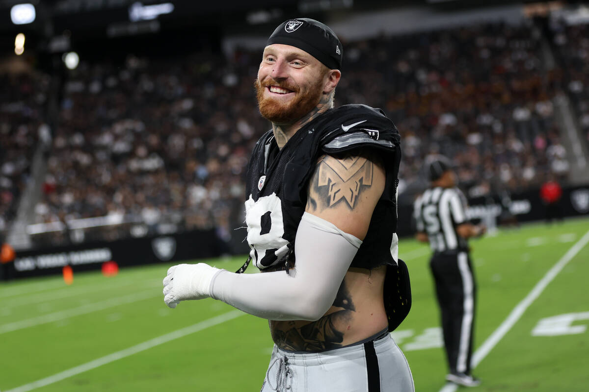 Raiders defensive end Maxx Crosby (98) laughs on the sideline during an NFL football practice a ...