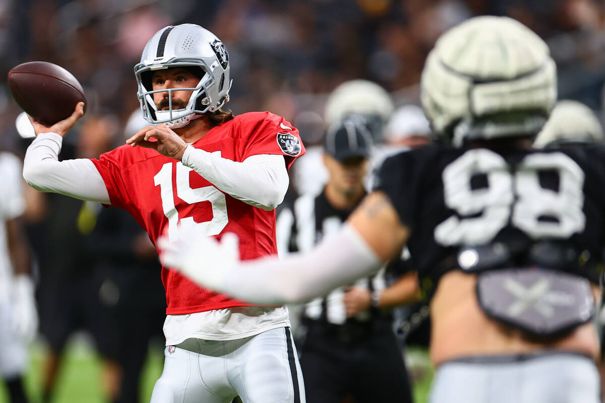 Raiders quarterback Gardner Minshew II (15) throws ups he field during an NFL football practice ...