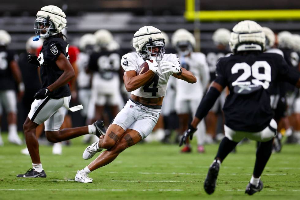 Raiders wide receiver Jalen Guyton (4) carries the ball up the field during an NFL football pra ...