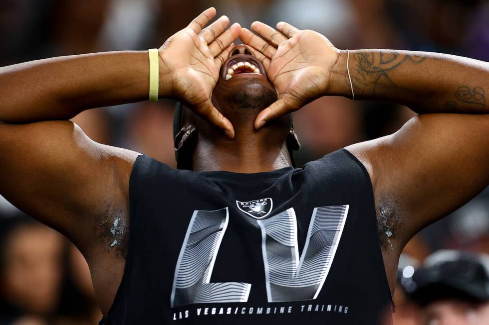 A Raiders fan screams for his team during an NFL football practice at Allegiant Stadium on Wedn ...