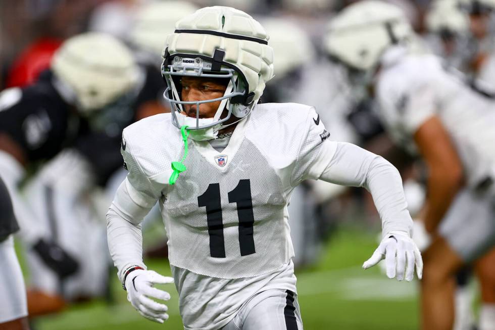 Raiders wide receiver Tre Tucker (11) runs into play during an NFL football practice at Allegia ...