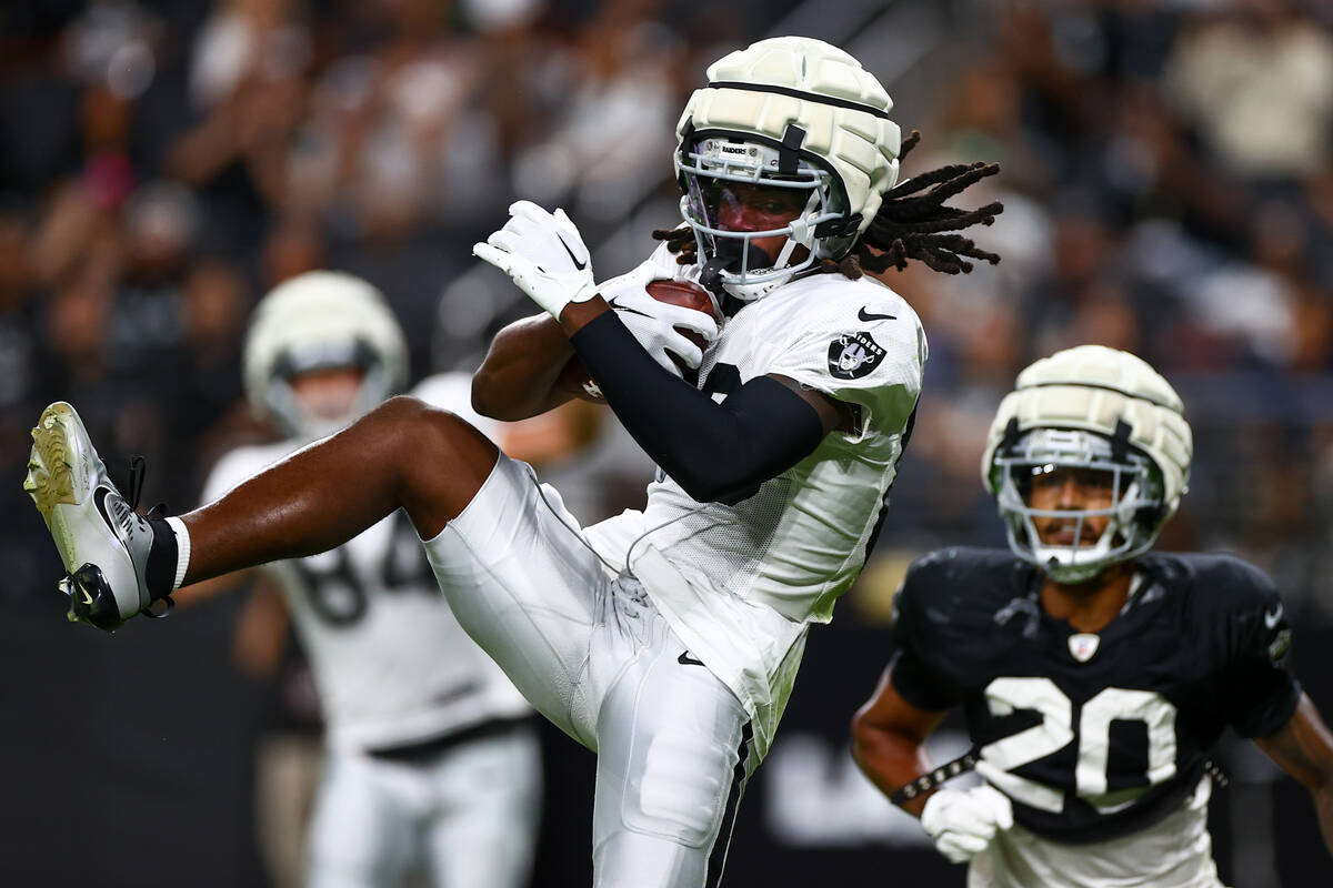 Raiders wide receiver Kristian Wilkerson catches a touchdown pass during an NFL football practi ...