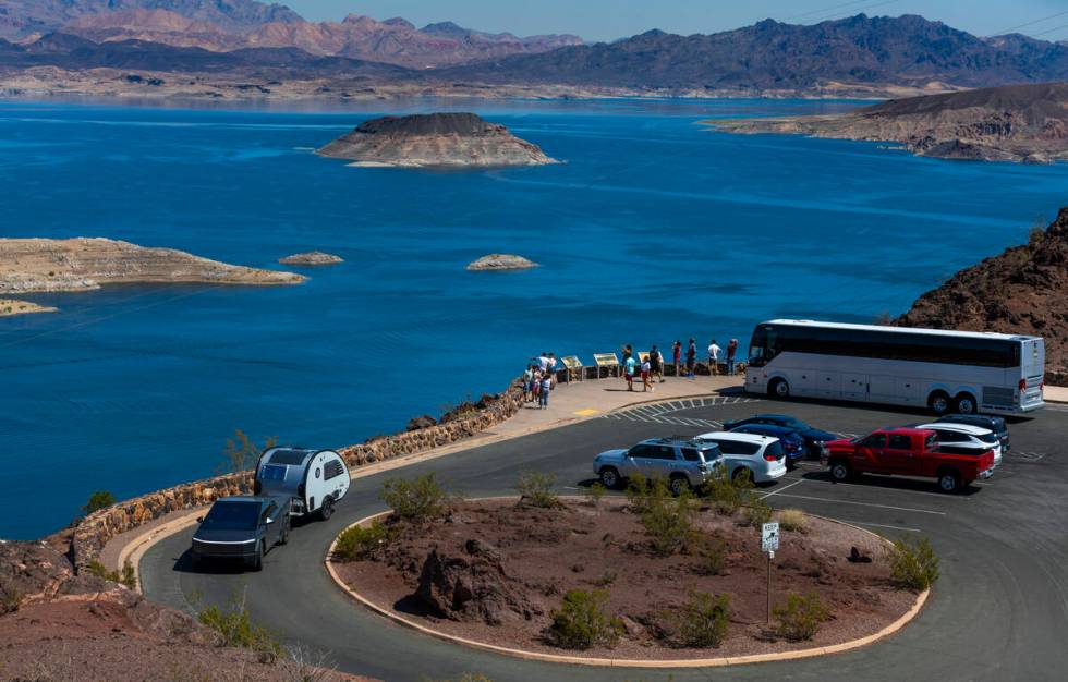 A tour bus drops off passengers to view Lake Mead from the Lakeview Overlook on Thursday, Aug. ...