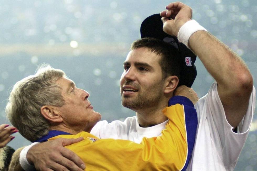 St. Louis Rams quarterback Kurt Warner, right, gets a hug from Rams coach Dick Vermeil after th ...