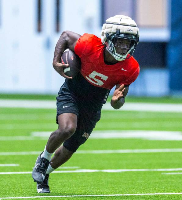 UNLV running back Greg Burrell (5) runs up the field during football practice at the Intermount ...