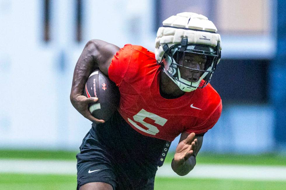 UNLV running back Greg Burrell (5) runs up the field during football practice at the Intermount ...