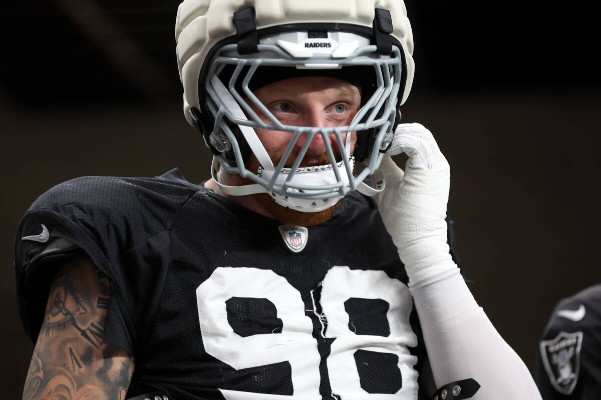 Raiders defensive end Maxx Crosby (98) takes the field for an NFL football practice at Allegian ...