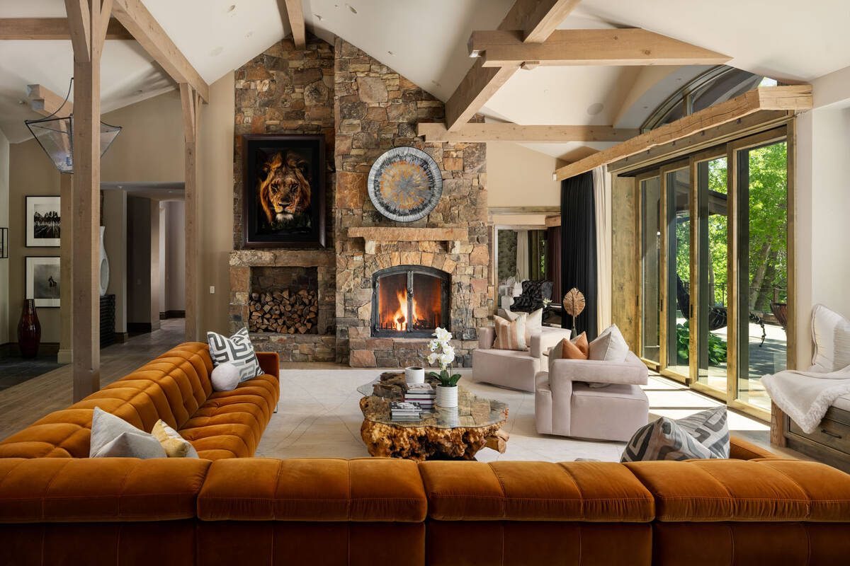 The living room has a wood-burning fireplace. (Chase International Luxury Real Estate)