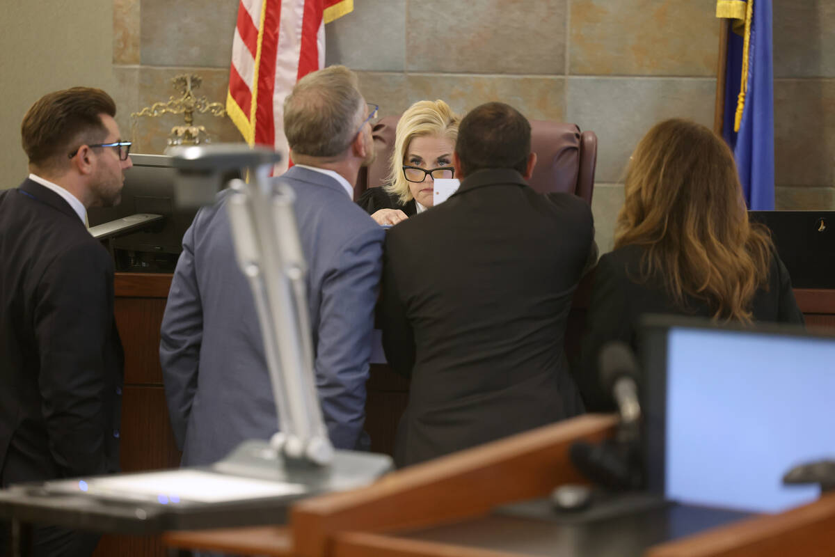 District Judge Michelle Leavitt talks to defense attorneys Michael Horvath, from left, Robert D ...