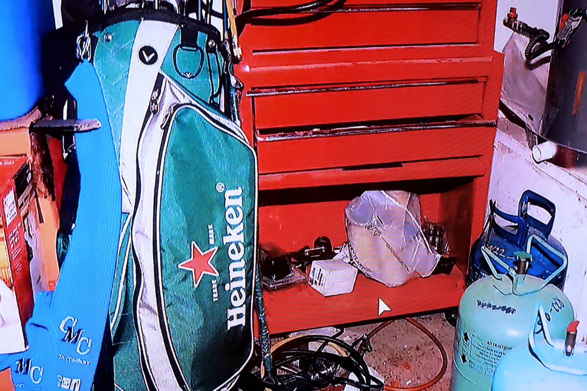 A shopping bag is shown in an evidence photo taken in the garage of Robert Telles on the fourth ...