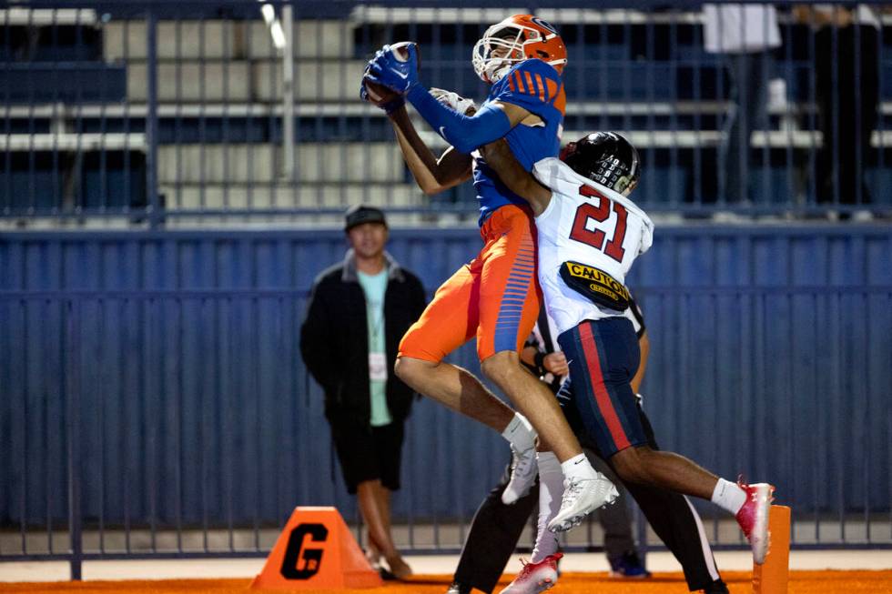 Bishop Gorman wide receiver Derek Meadows (30) catches a touchdown pass while Coronado defensiv ...