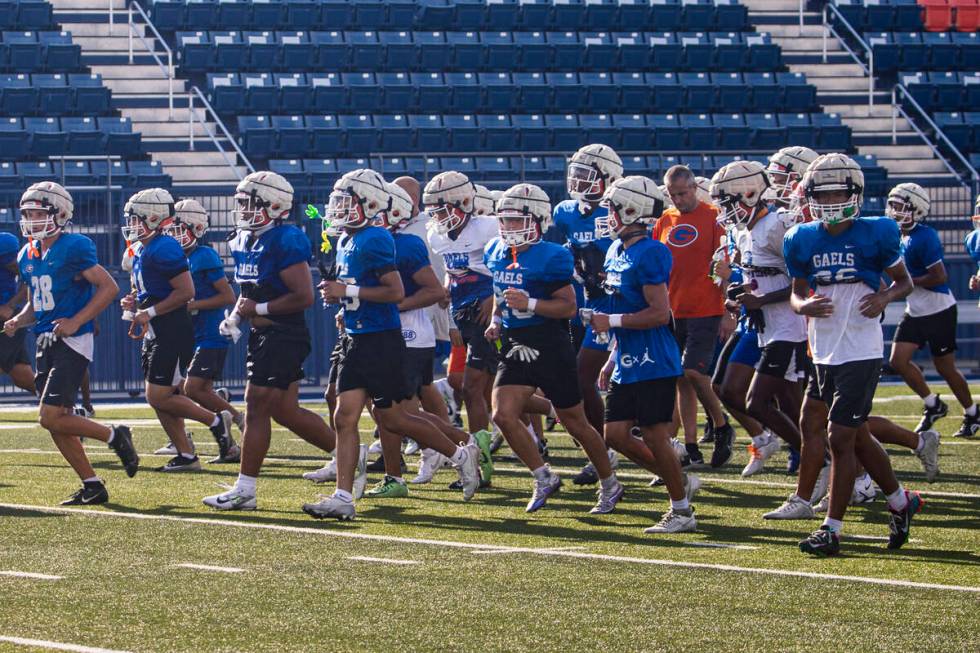 Bishop Gorman football players head off the field at the end of practice on Thursday, Aug. 8, 2 ...