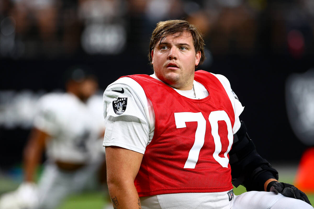 Raiders guard Jackson Powers-Johnson (70) stretches during an NFL football practice at Allegian ...