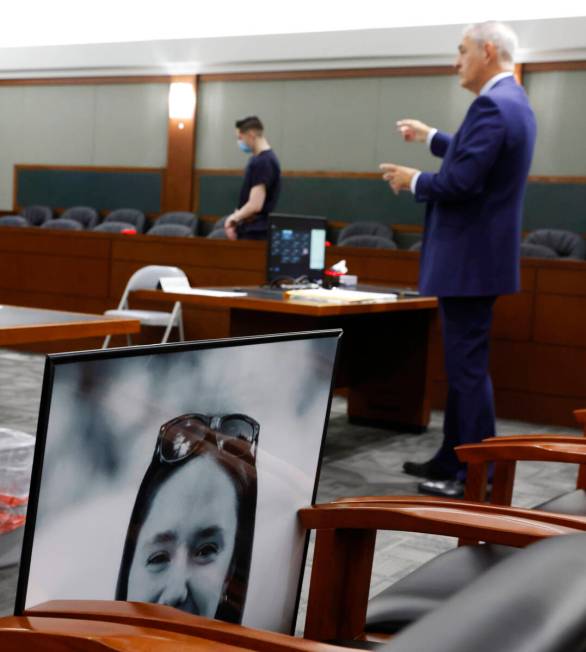 A photograph of murder victim Paula Davis is displayed as attorney Gabriel Grasso, right, repre ...