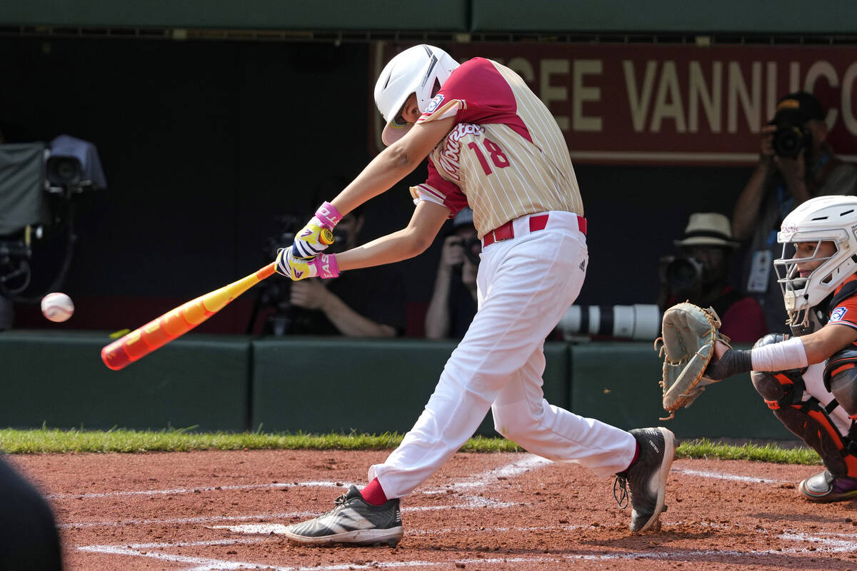 Paseo Verde's Wyatt Erickson hits a two-run double off Staten Island, N.Y.'s Stephen Grippo dur ...