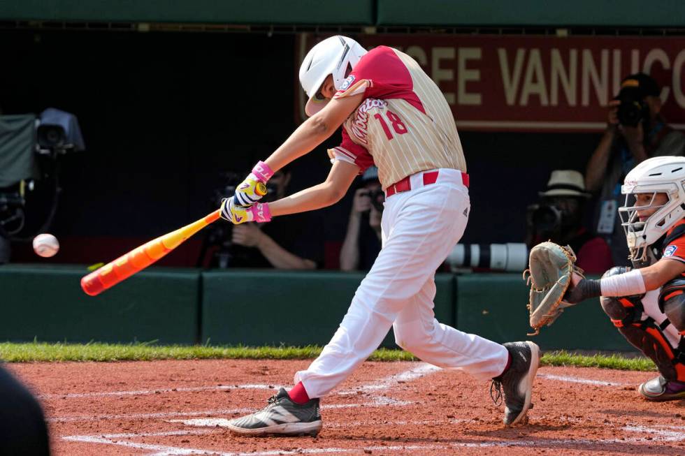 Paseo Verde's Wyatt Erickson hits a two-run double off Staten Island, N.Y.'s Stephen Grippo dur ...