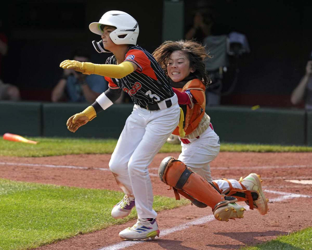 Staten Island, N.Y.'s Chace Curro, left, is tagged out by Paseo Verde's Parker Soranaka while a ...