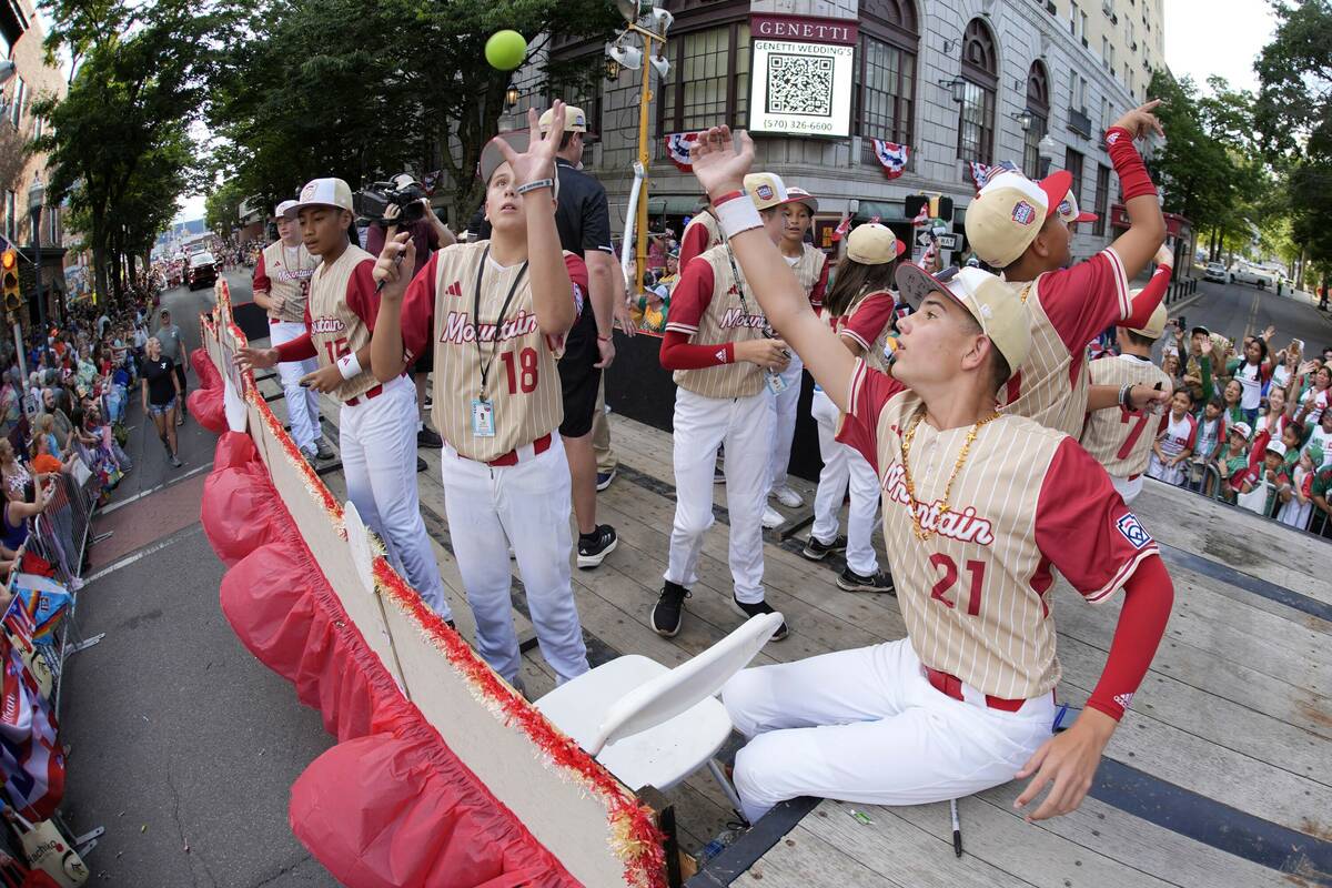 Mountain Region champions Paseo Verde from Henderson ride in the Little League Grand Slam Parad ...