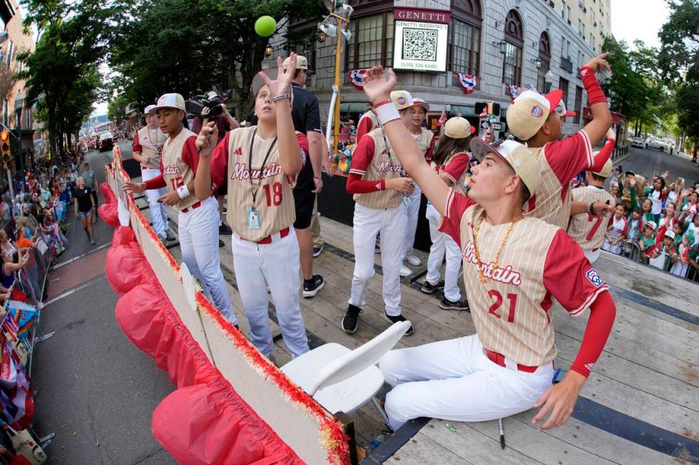 Mountain Region champions Paseo Verde from Henderson ride in the Little League Grand Slam Parad ...