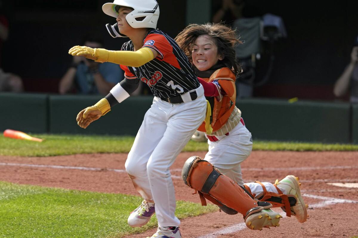 Staten Island, N.Y.'s Chace Curro, left, is tagged out by Paseo Verde's Parker Soranaka while a ...