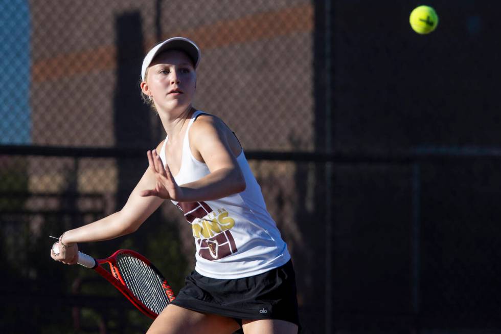 Faith Lutheran sophomore McCauley Hill competes during the tennis matches against The Meadows a ...