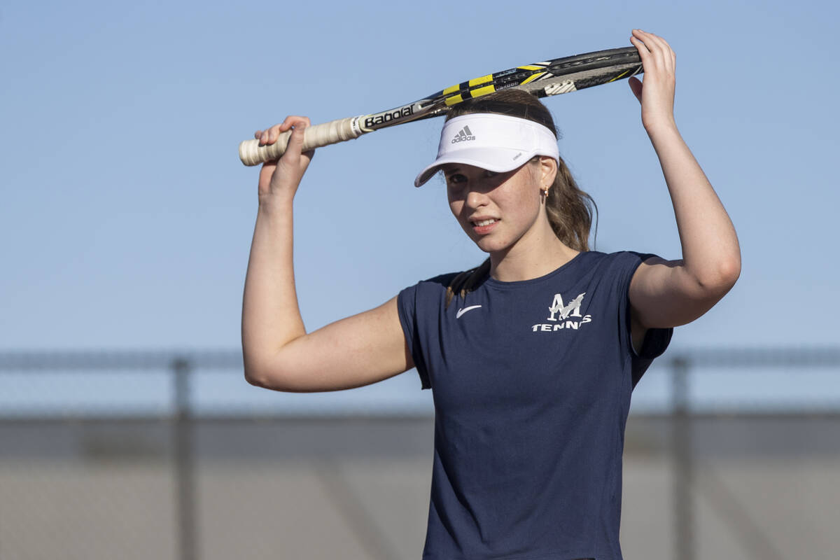 The Meadows senior Camilla Osipova places her racket on her head during the tennis matches agai ...