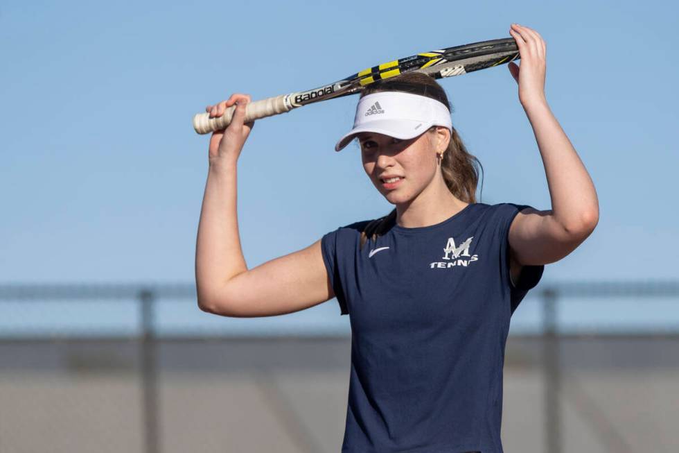 The Meadows senior Camilla Osipova places her racket on her head during the tennis matches agai ...