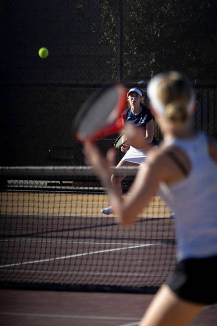 The Meadows senior Camilla Osipova, back, and Faith Lutheran sophomore McCauley Hill, front, co ...