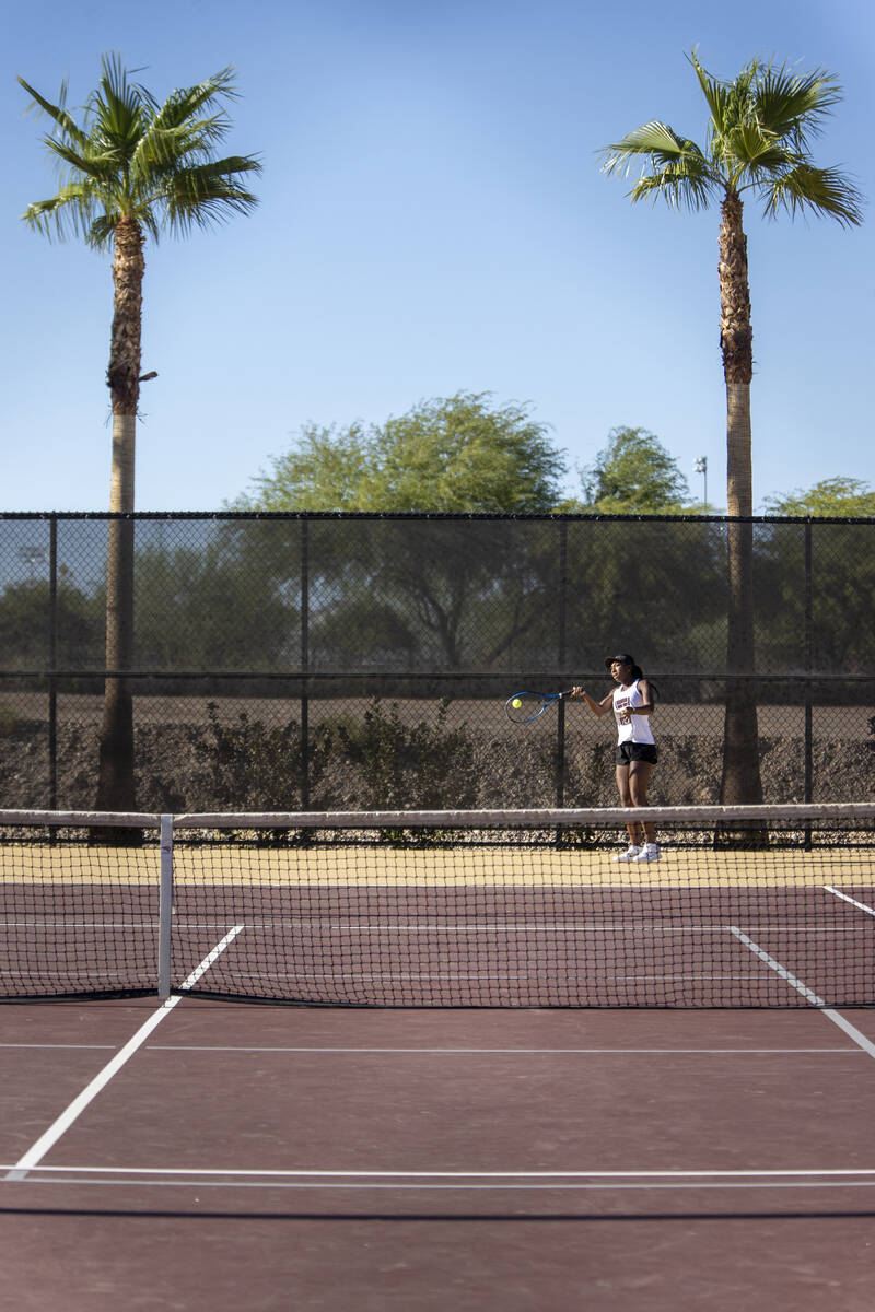 Faith Lutheran senior Zoe Slusher competes during the tennis matches against The Meadows at Fai ...