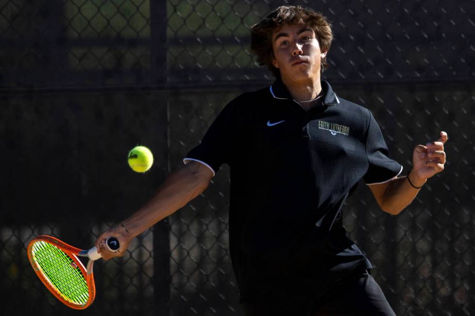 Faith Lutheran junior Beckham Butler competes during the tennis matches against The Meadows at ...