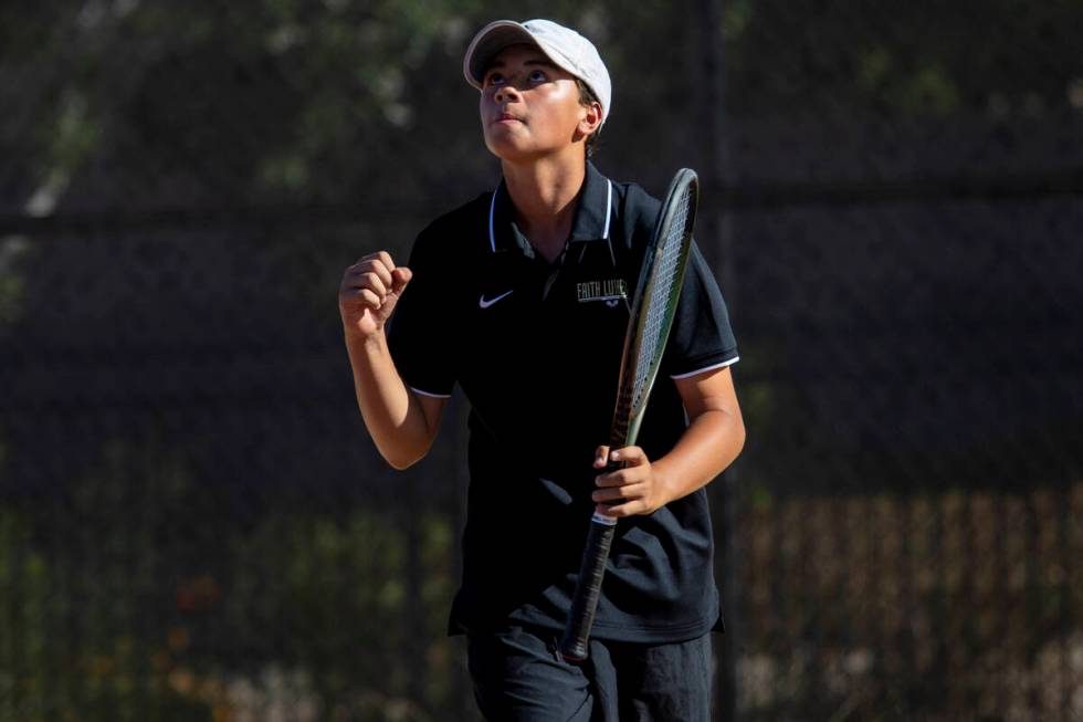 Faith Lutheran freshman Tyson Young celebrates during a tennis match against The Meadows at Fai ...