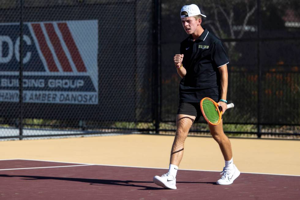 Faith Lutheran sophomore David Gluth III celebrates during the tennis matches against The Meado ...