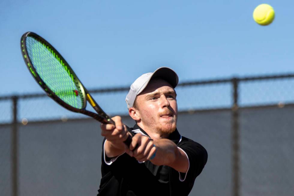 Faith Lutheran senior Nolan Dubay competes during the tennis matches against The Meadows at Fai ...