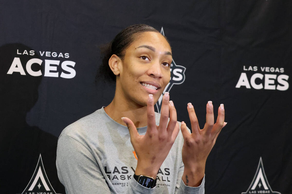 Las Vegas Aces center A’ja Wilson answers a question during a press conference following ...