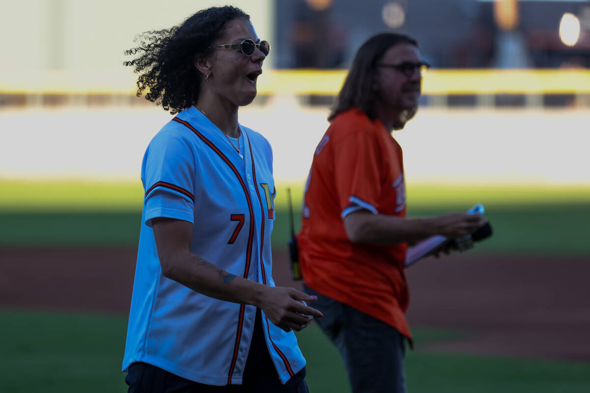 Las Vegas Aces forward Alysha Clark reacts after throwing the first pitch during a Minor League ...