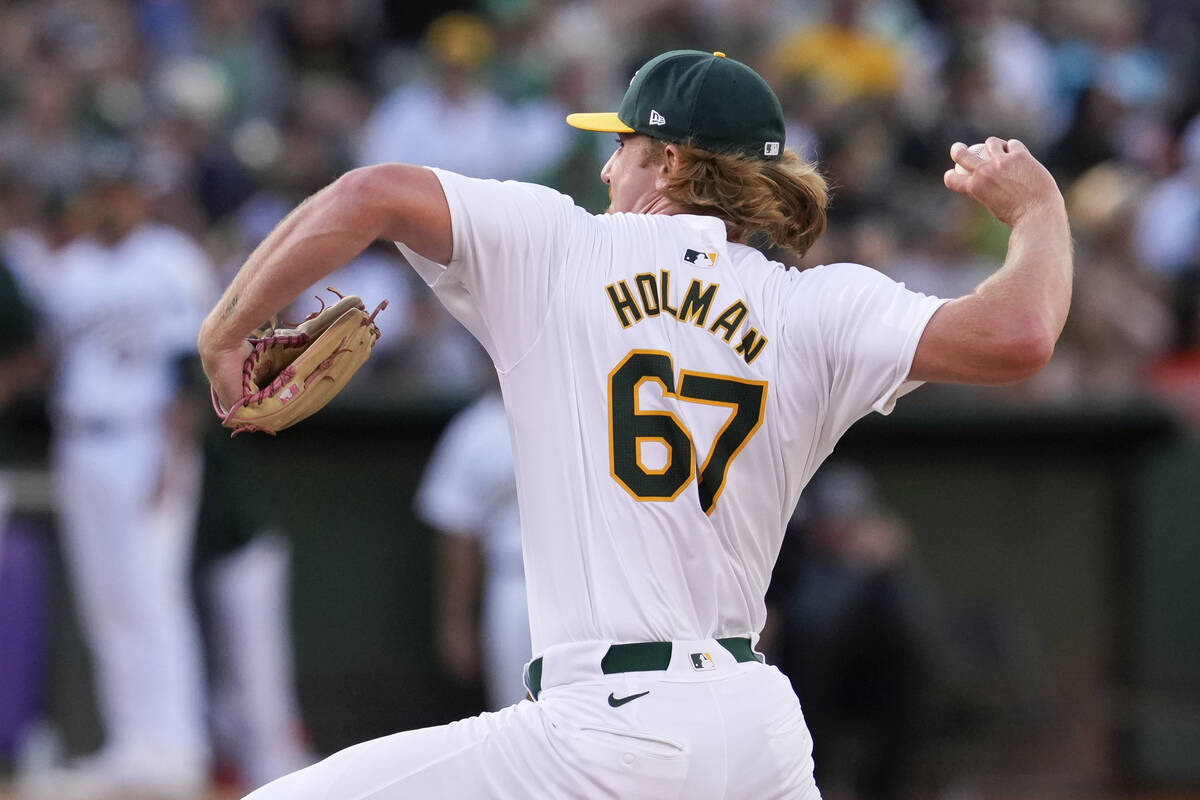 Oakland Athletics' Grant Holman pitches to a San Francisco Giants batter during the eighth inni ...