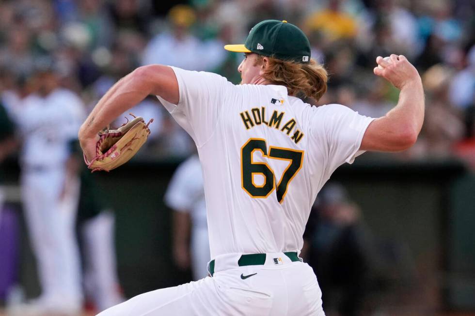 Oakland Athletics' Grant Holman pitches to a San Francisco Giants batter during the eighth inni ...