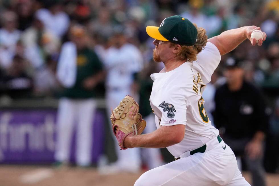 Oakland Athletics' Grant Holman pitches to a San Francisco Giants batter during the eighth inni ...