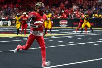 Vegas Knight Hawks quarterback Ja'Rome Johnson runs toward the end zone before scoring a touchd ...