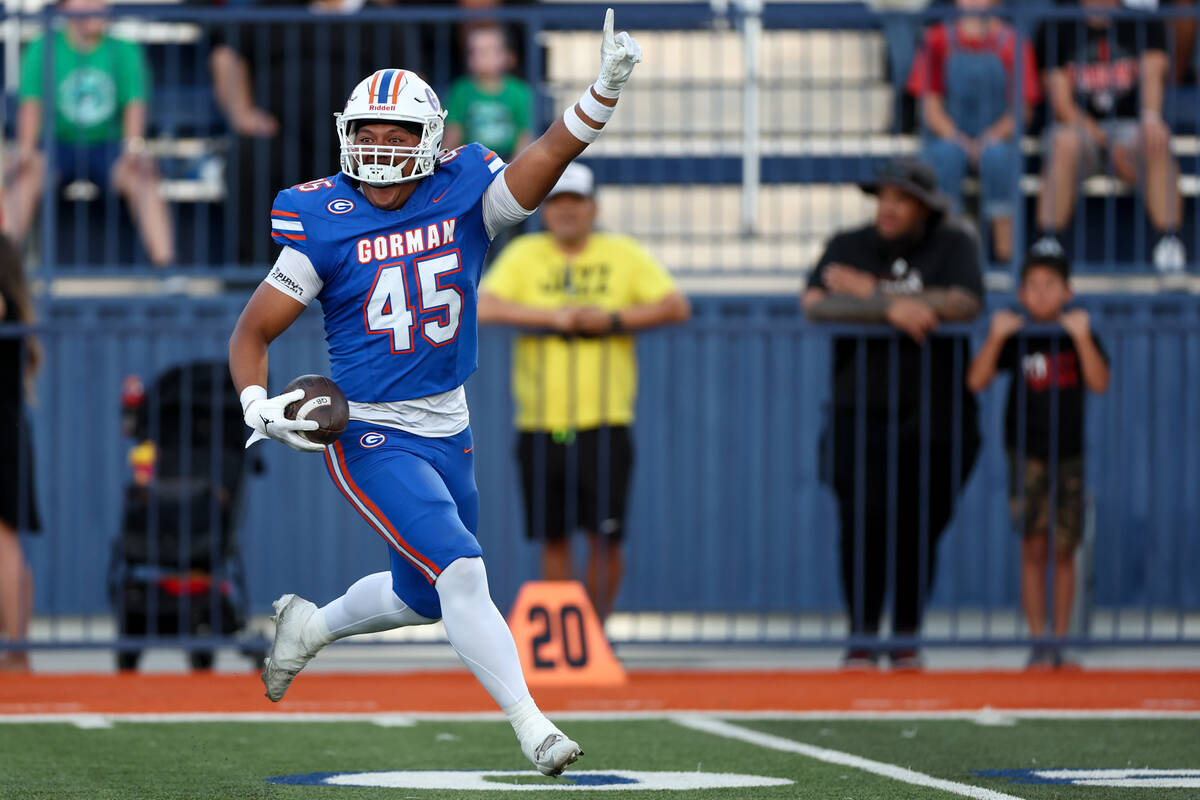 Bishop Gorman tight end Eli Yamauchi (45) celebrates after catching an interception during the ...