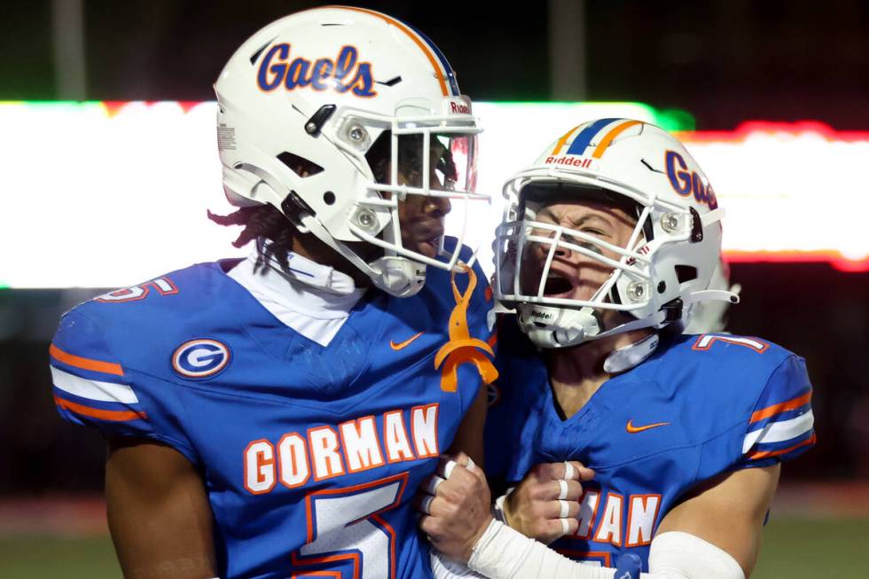 Bishop Gorman defensive back Brayton Correa (7) celebrates after defensive back Jett Washington ...